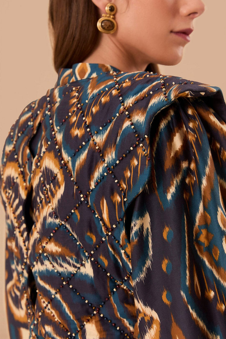 FARM Rio model wearing the Pineapple Ikat Blue Long Sleeve Matelasse Blouse