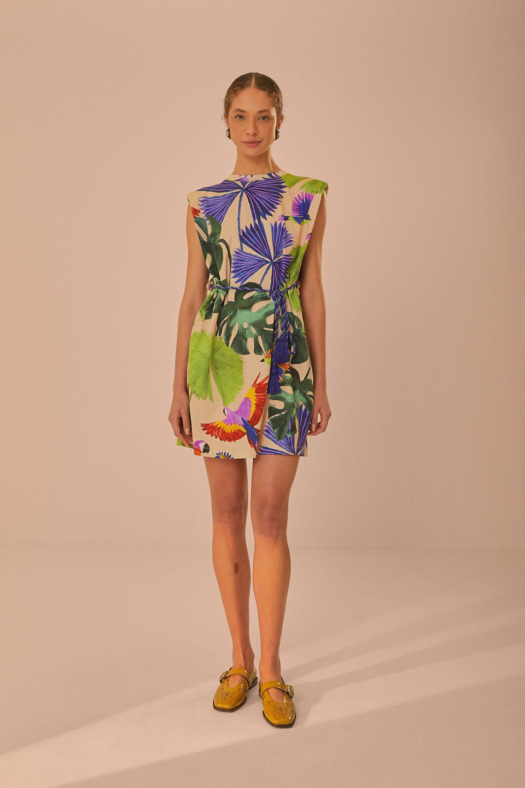 FARM Rio model wearing the Sand Macaw Jungle Organic Cotton T-Shirt Dress