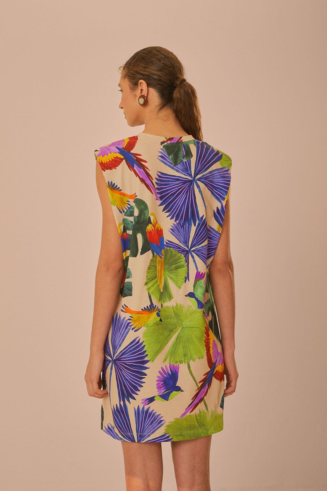 FARM Rio model wearing the Sand Macaw Jungle Organic Cotton T-Shirt Dress