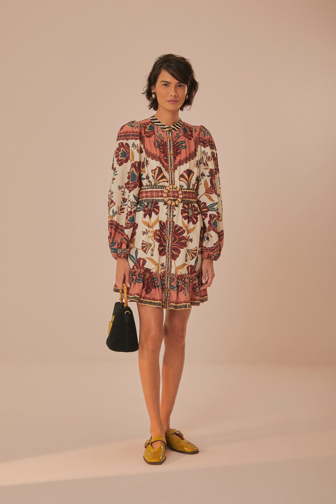 FARM Rio model wearing the Riad Cream Mini Dress