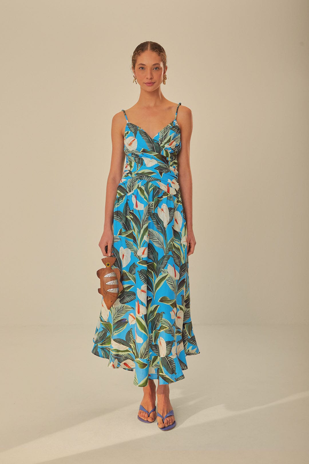 FARM Rio model wearing the Anthurium Garden Blue Cross Over Maxi Dress