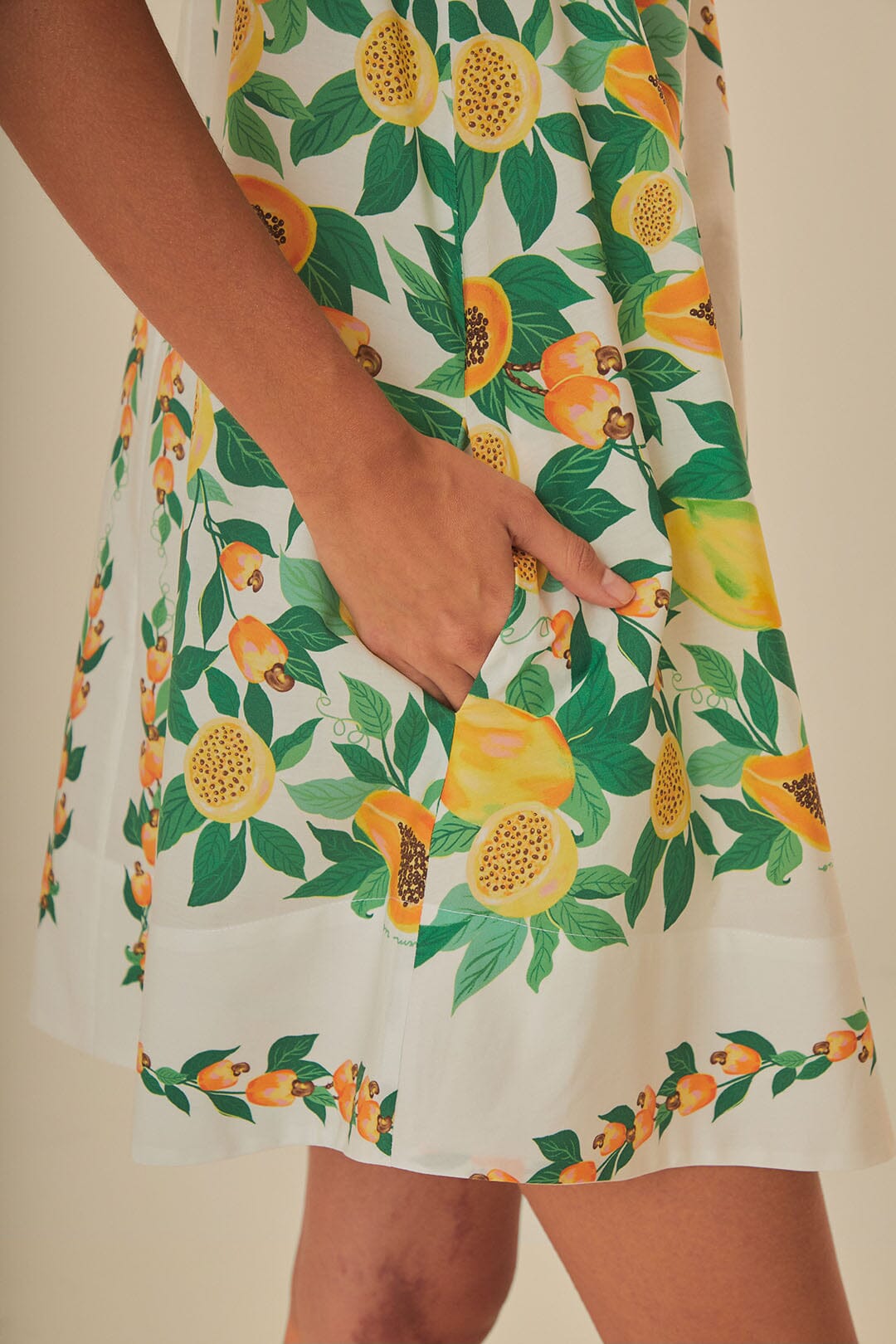 FARM Rio model wearing the Papaya Salad Scarf Mini Dress