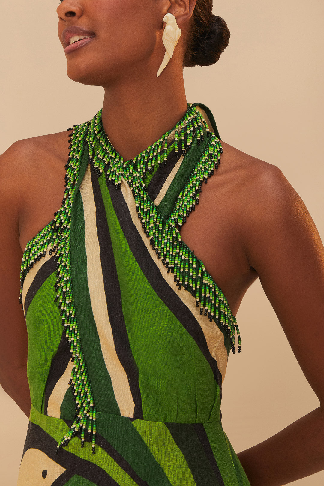 FARM Rio model wearing the Toucan Tree Green Dress
