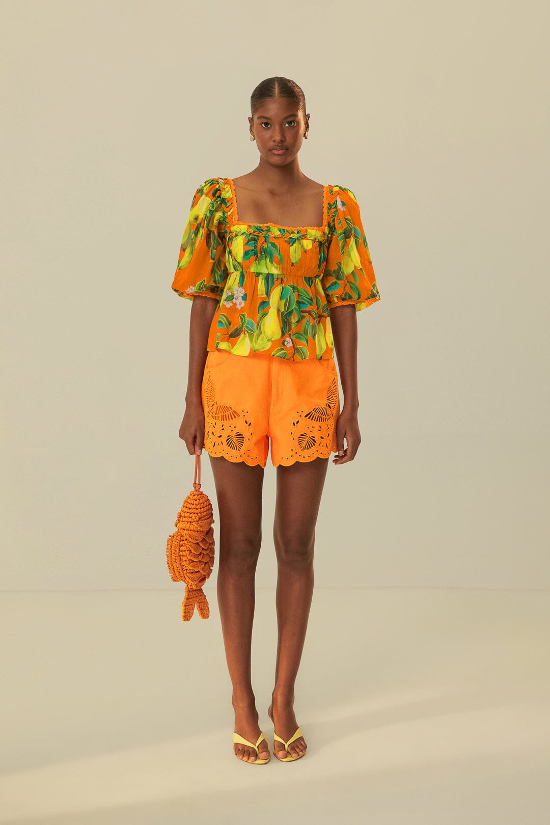 FARM Rio model wearing the Orange Chic Pears Short Sleeves Blouse