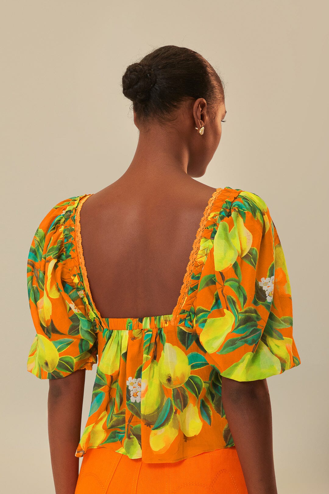 FARM Rio model wearing the Orange Chic Pears Short Sleeves Blouse