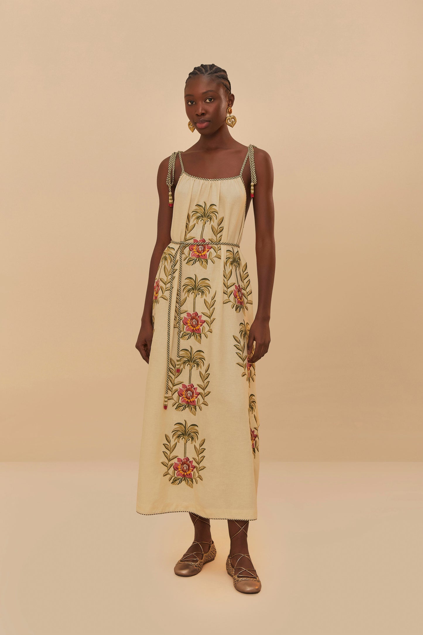FARM Rio model wearing the Tropical Flower Embroidered Sand Maxi Dress