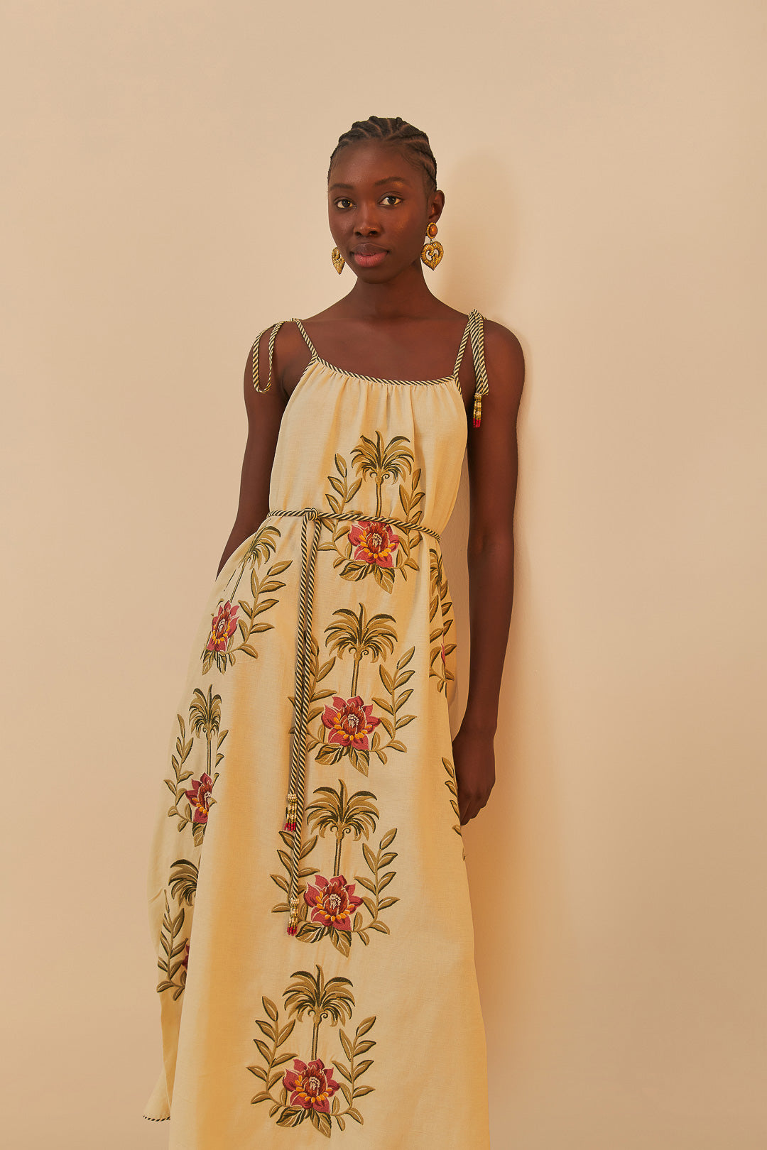 FARM Rio model wearing the Tropical Flower Embroidered Sand Maxi Dress