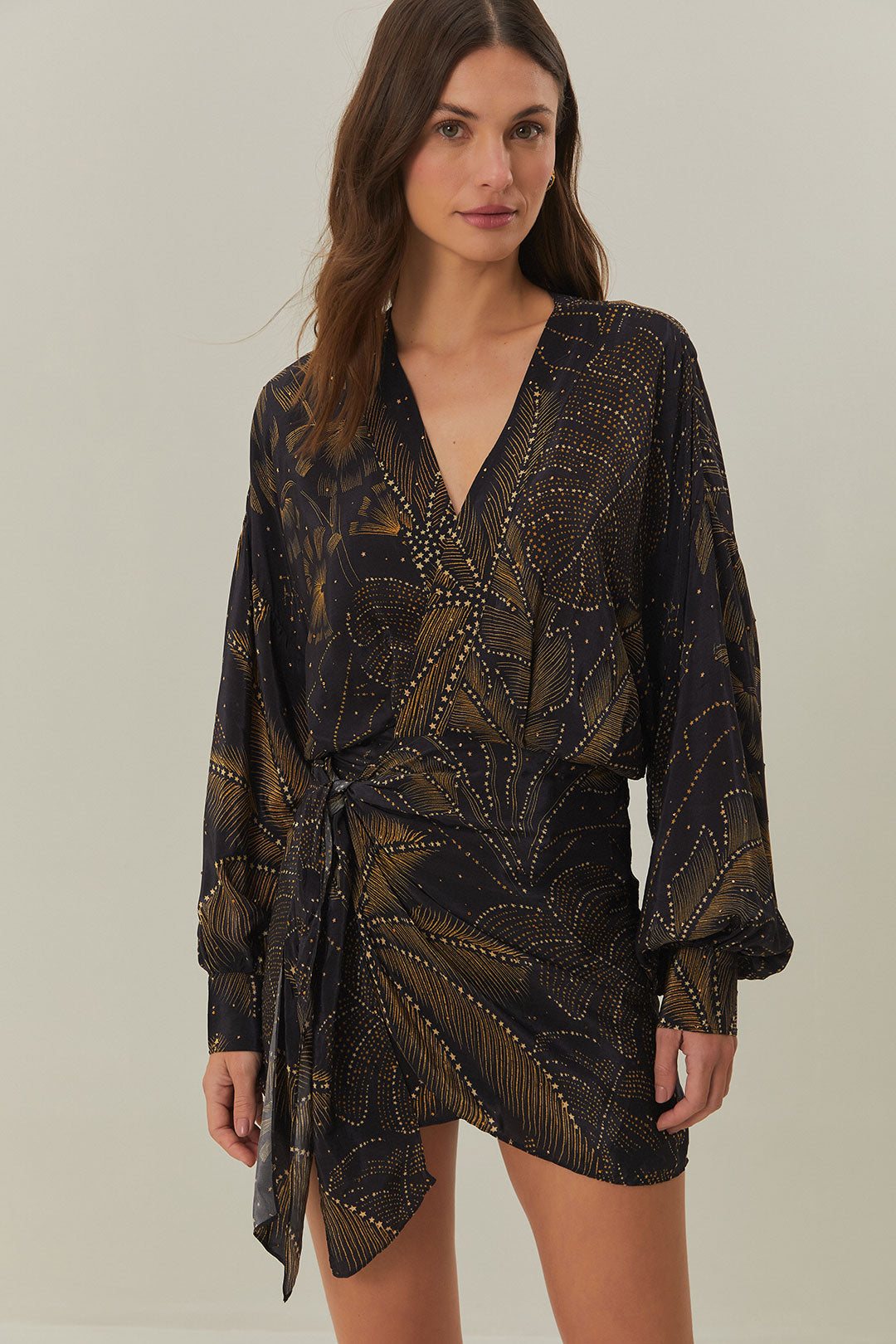 FARM Rio model wearing the Golden Foliage Black Mini Dress Puffy Sleeve