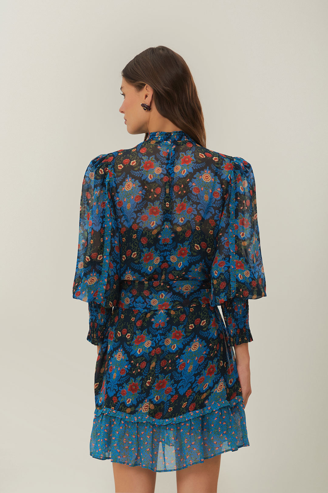 FARM Rio model wearing the Blue Arabesque Floral High Neck Mini Dress