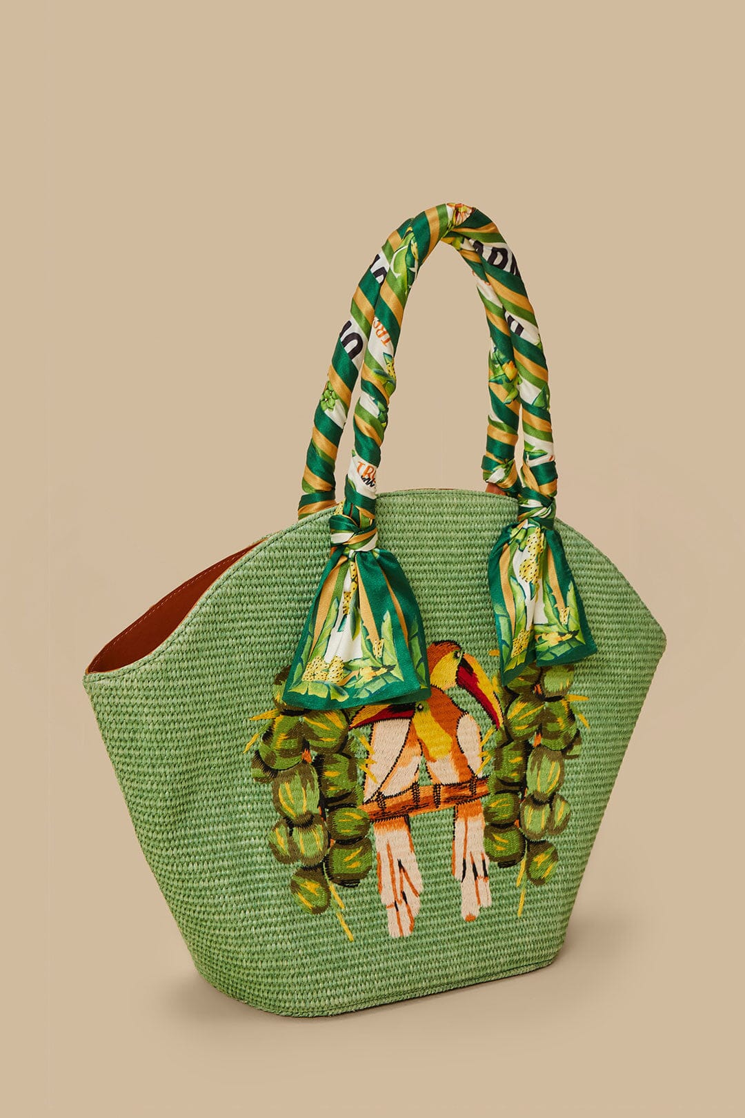 FARM Rio model wearing the Green Coconut Toucan Raffia Shell Tote