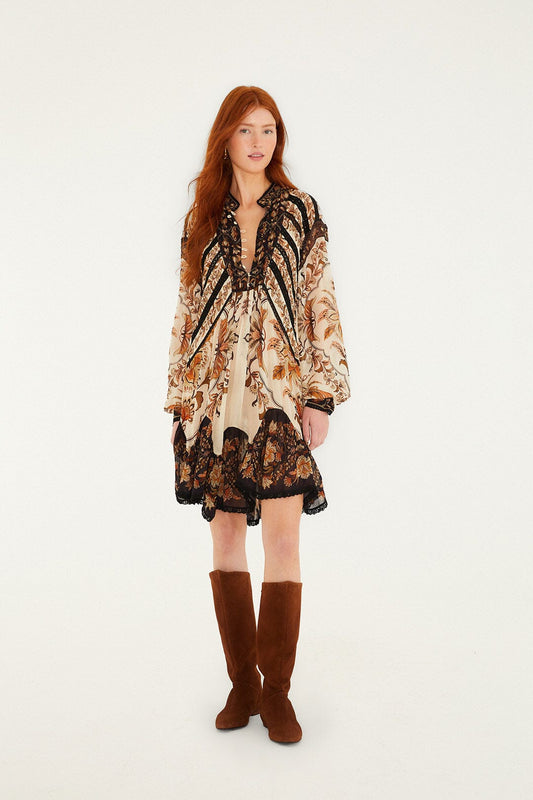 FARM Rio model wearing the Sand Majestic Garden Lace Long Sleeve Mini Dress