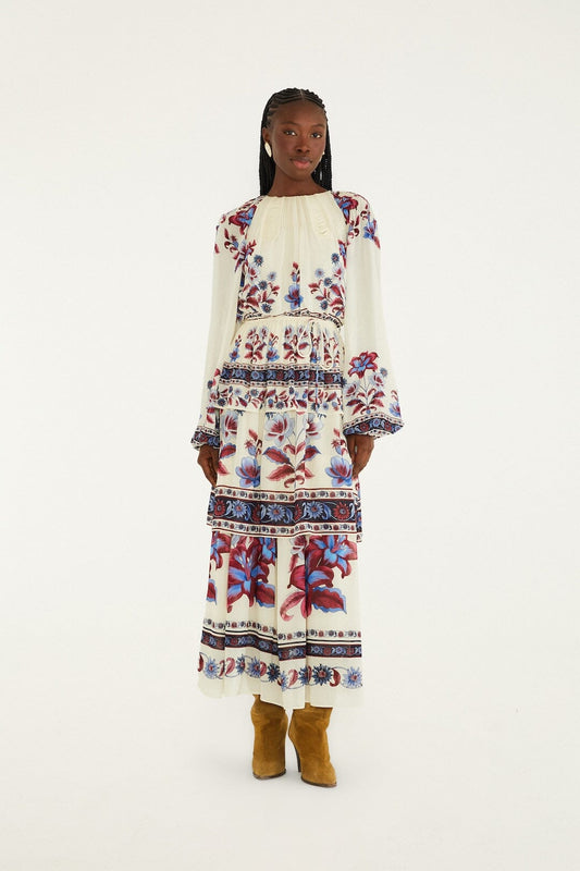 FARM Rio model wearing the White Malu Winter Cut-Out Long Sleeve Maxi Dress