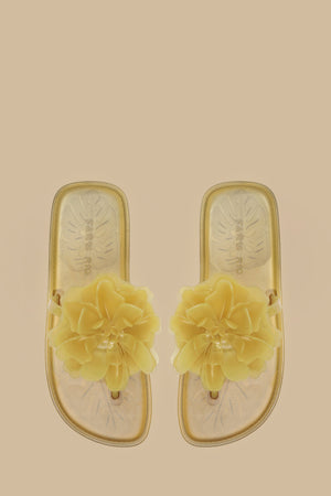 FARM Rio model wearing the Buttermilk Flower Jelly Flat Sandal