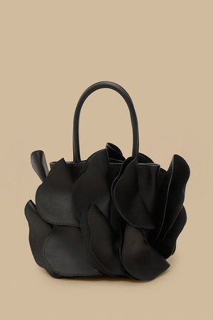 FARM Rio model wearing the Black Leather Flower Bag