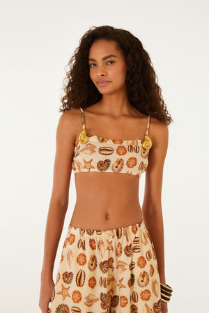 FARM Rio model wearing the Sand Marine Shells Broch Top