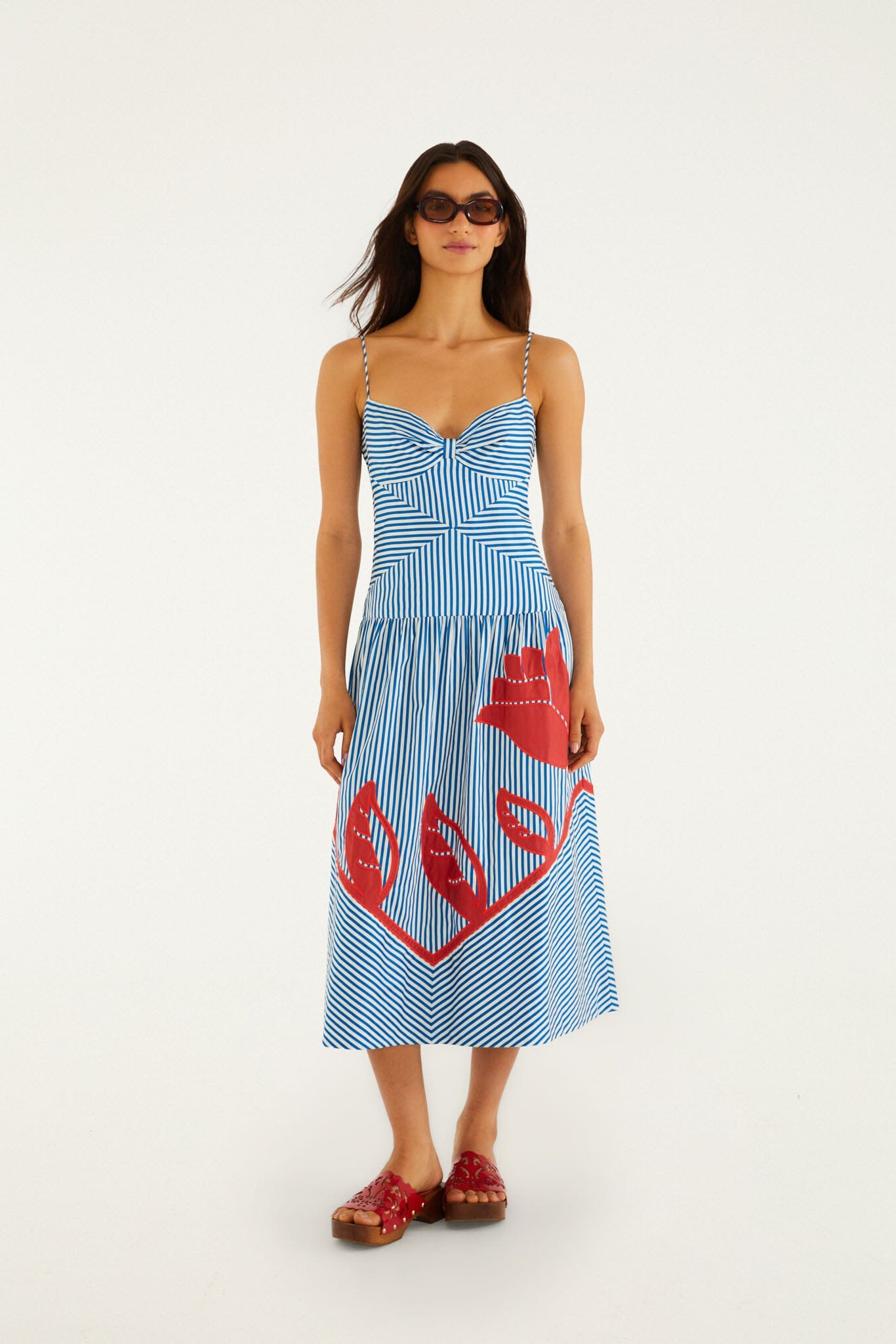 FARM Rio model wearing the Blue Sky Stripes Sleeveless Midi Dress