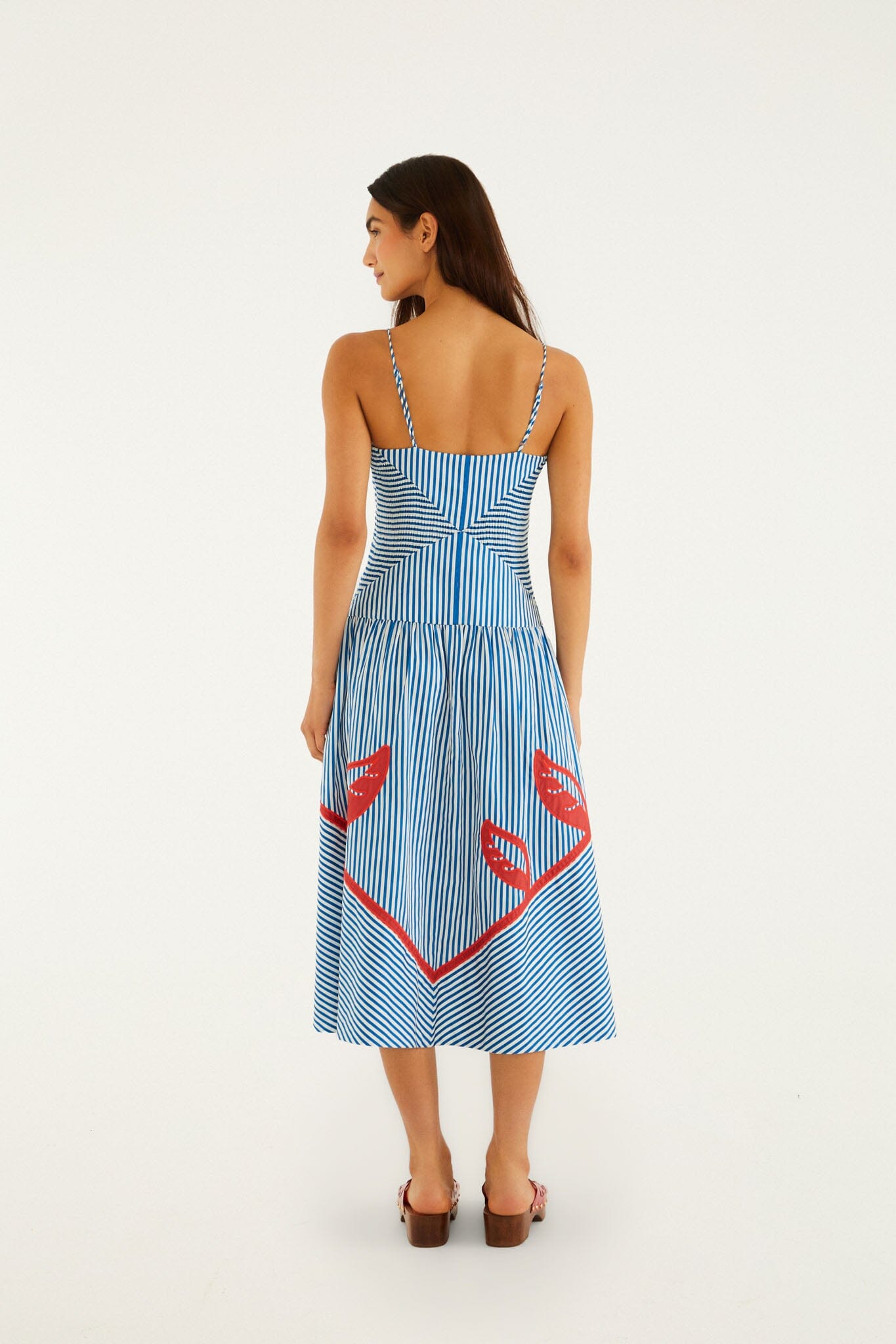 FARM Rio model wearing the Blue Sky Stripes Sleeveless Midi Dress