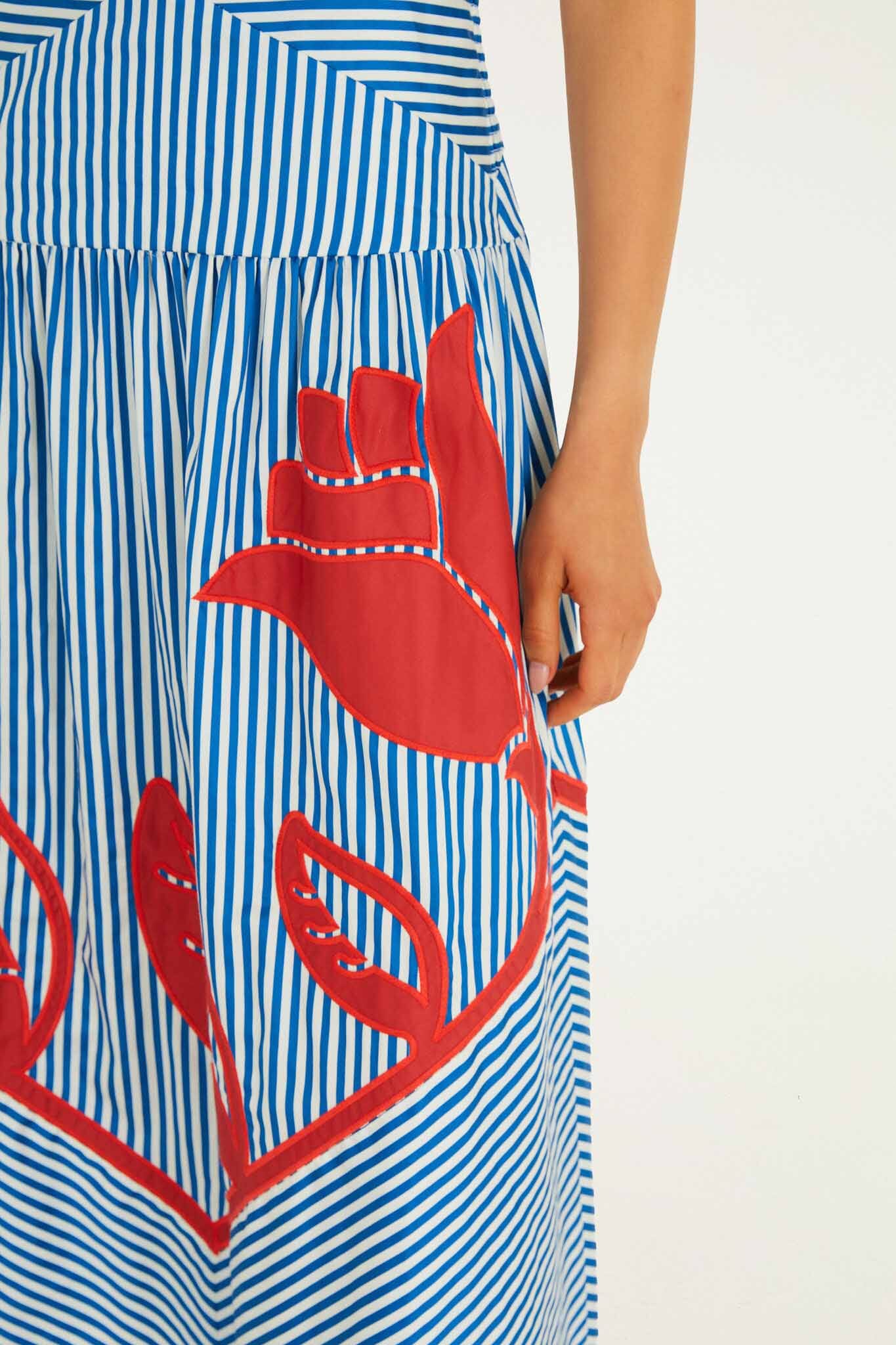 FARM Rio model wearing the Blue Sky Stripes Sleeveless Midi Dress