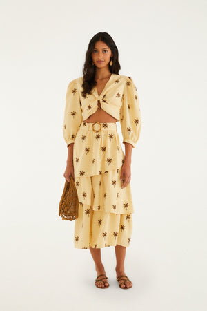 FARM Rio model wearing the Sand Embroidered Trees Buckled Layered Midi Skirt