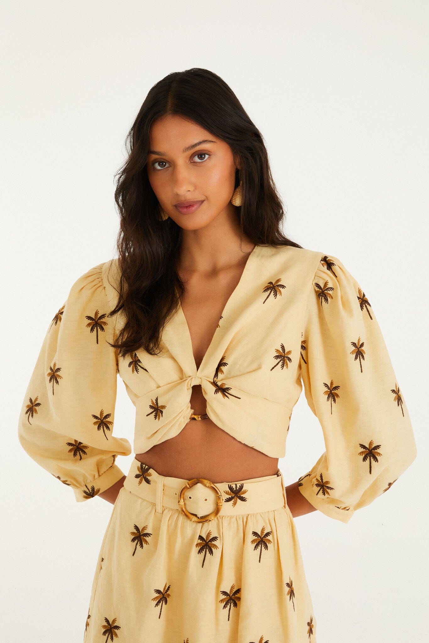 FARM Rio model wearing the Sand Embroidered Trees Buckled Long Sleeve Crop Top