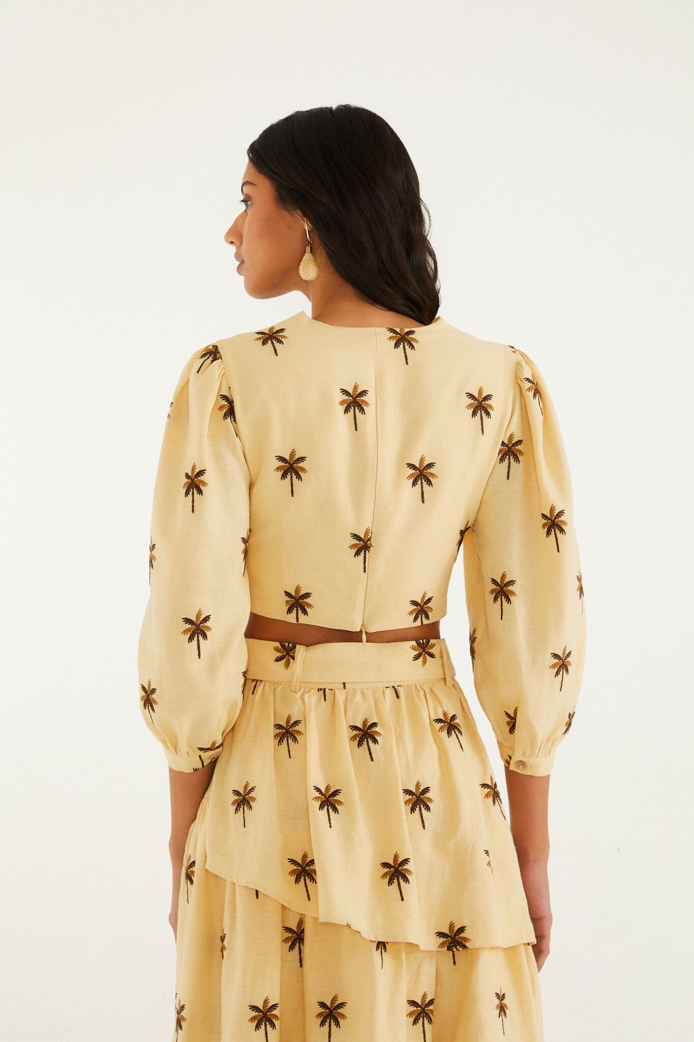FARM Rio model wearing the Sand Embroidered Trees Buckled Long Sleeve Crop Top