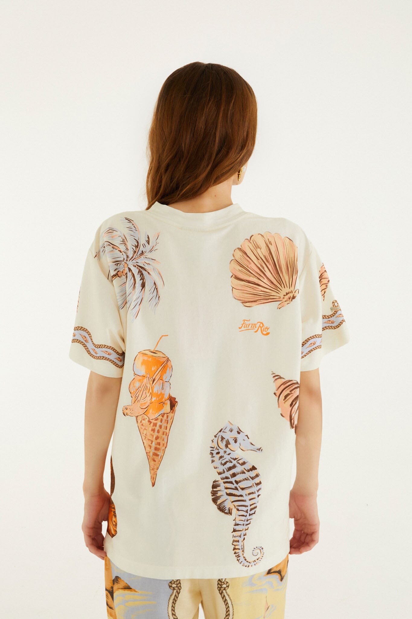 FARM Rio model wearing the Sand Rio Souvenir Short Sleeve T-Shirt