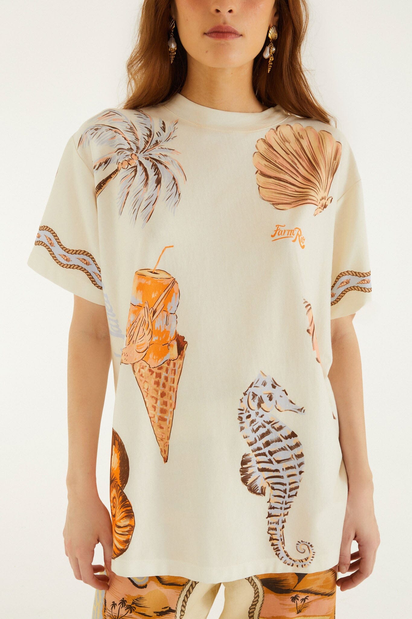 FARM Rio model wearing the Sand Rio Souvenir Short Sleeve T-Shirt