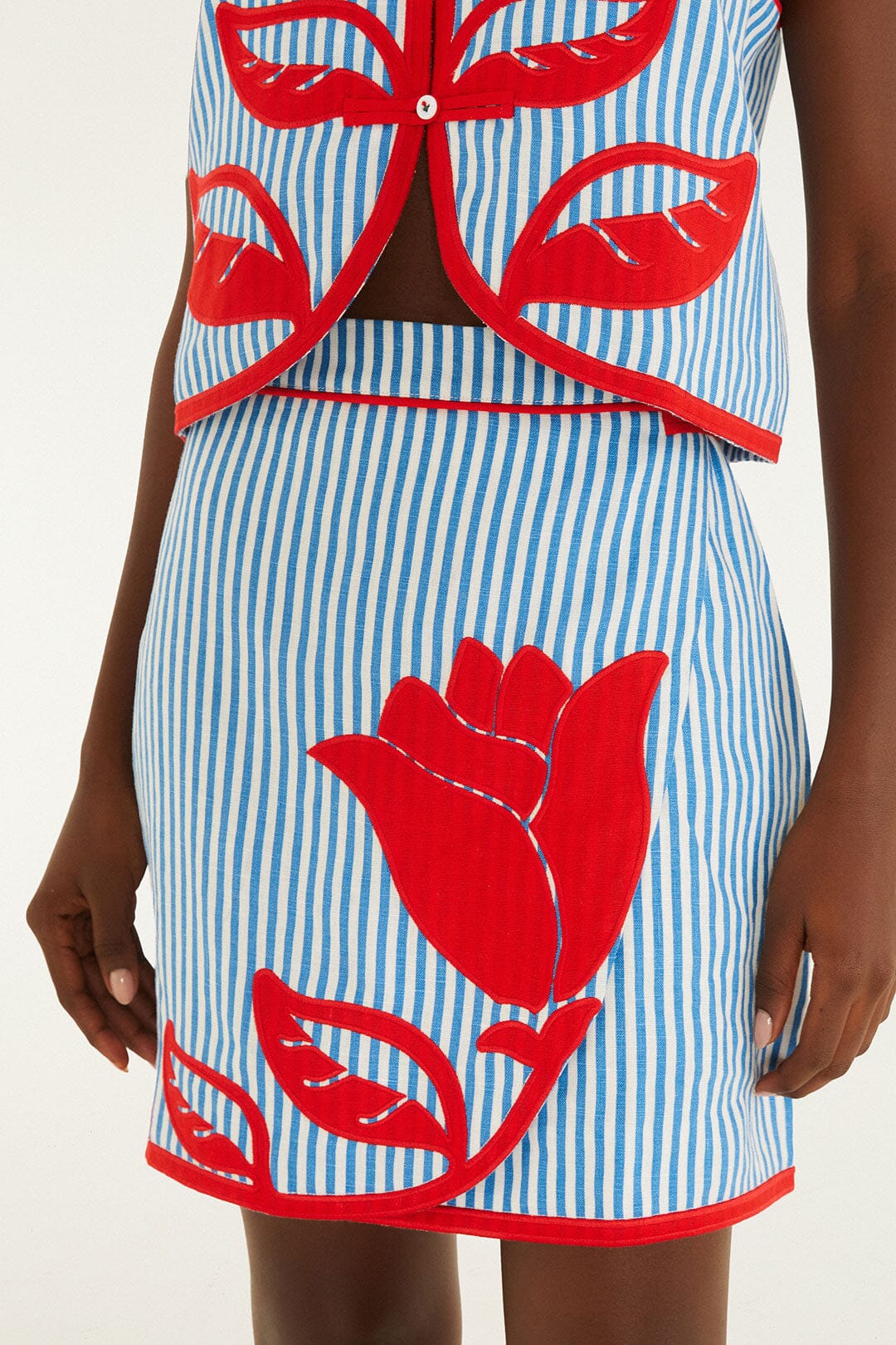 FARM Rio model wearing the Sky Stripes Blue Mini Skirt
