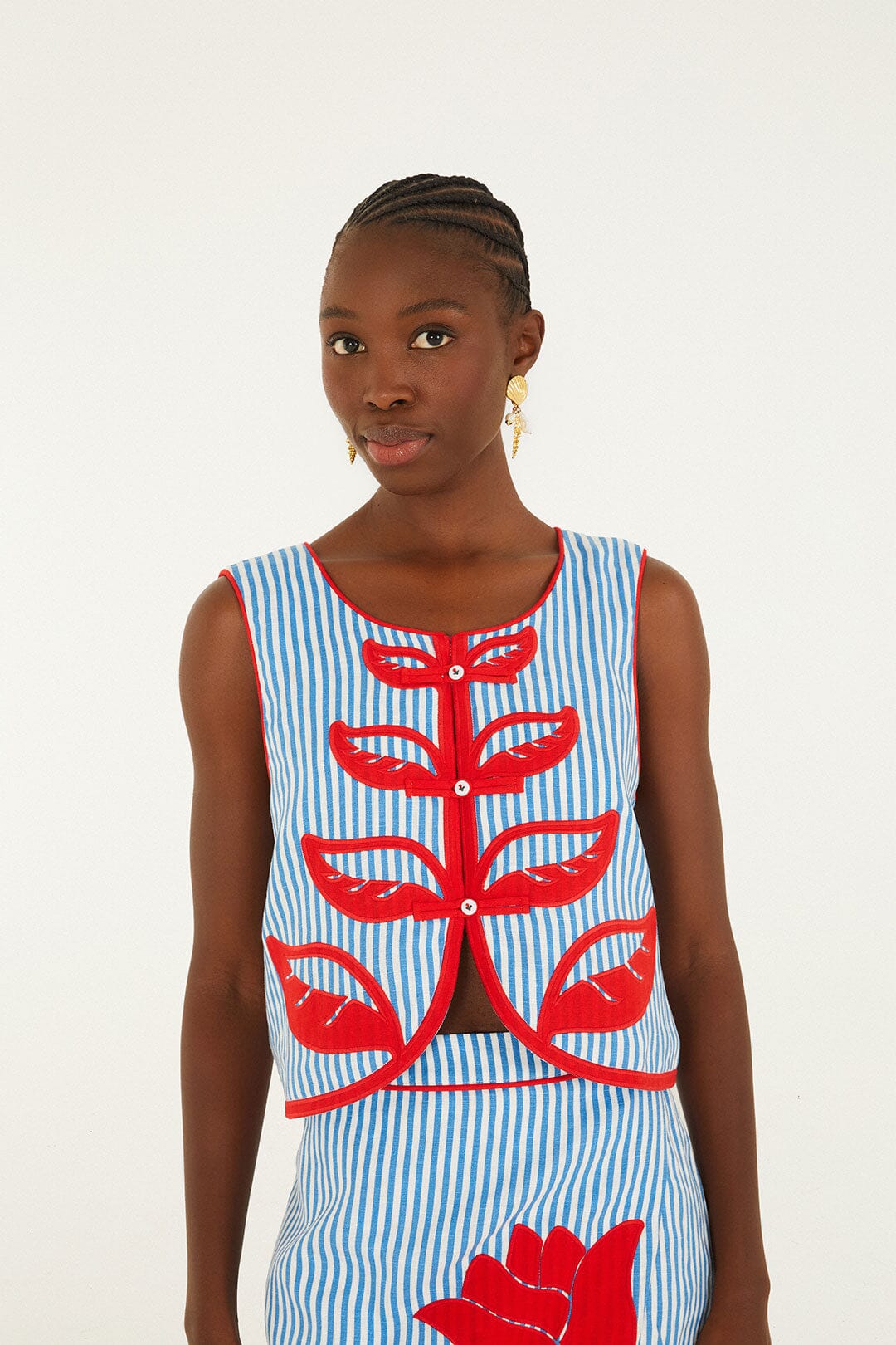 FARM Rio model wearing the Sky Stripes Blue Sleeveless Crop Top