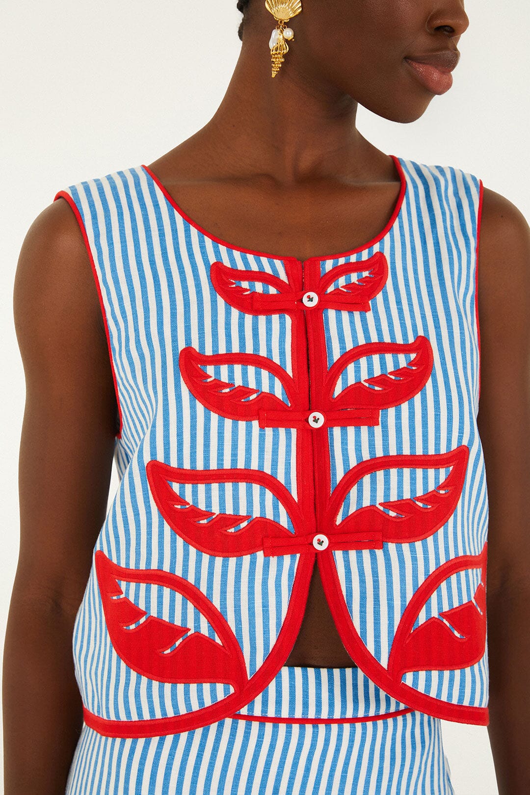 FARM Rio model wearing the Sky Stripes Blue Sleeveless Crop Top