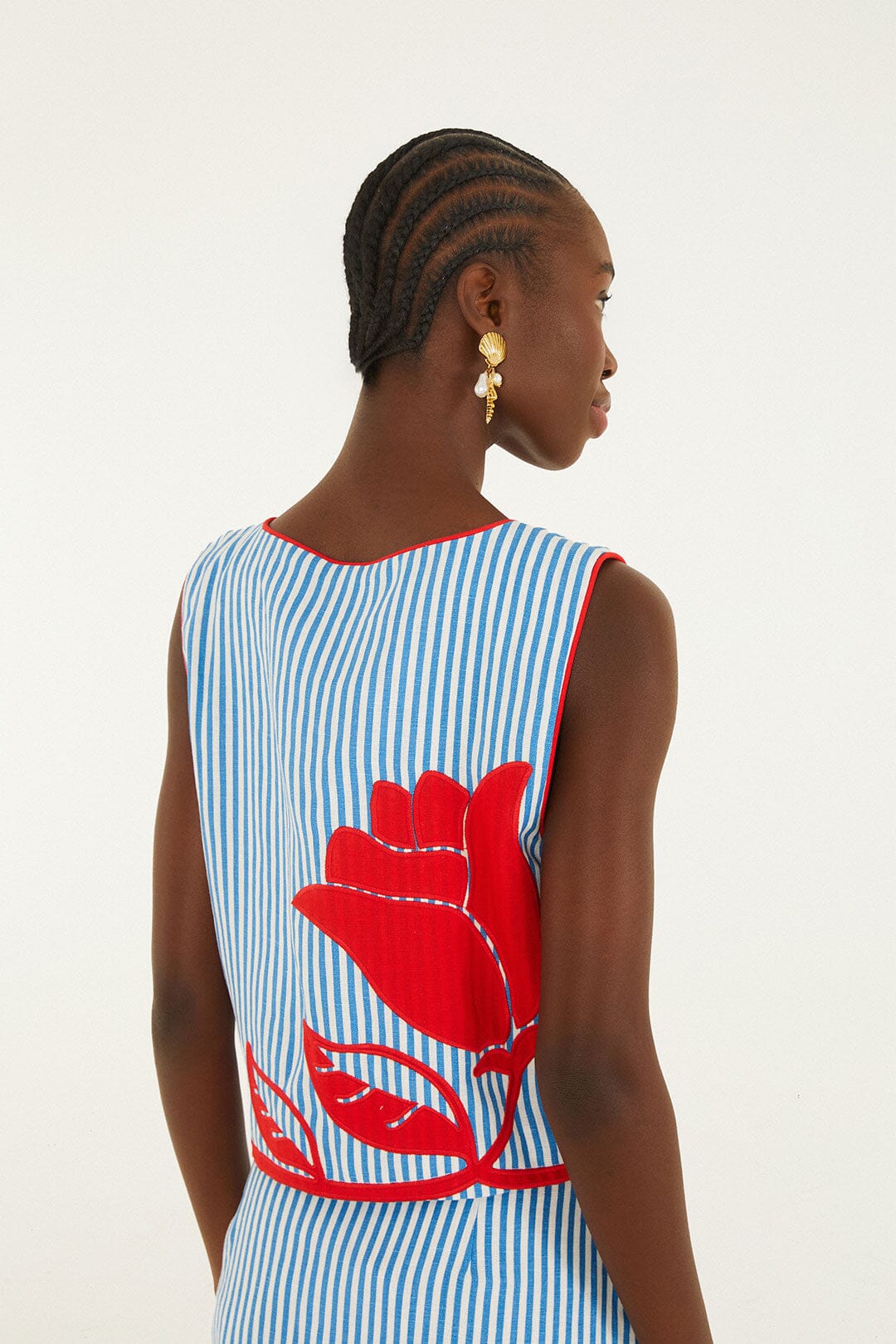 FARM Rio model wearing the Sky Stripes Blue Sleeveless Crop Top